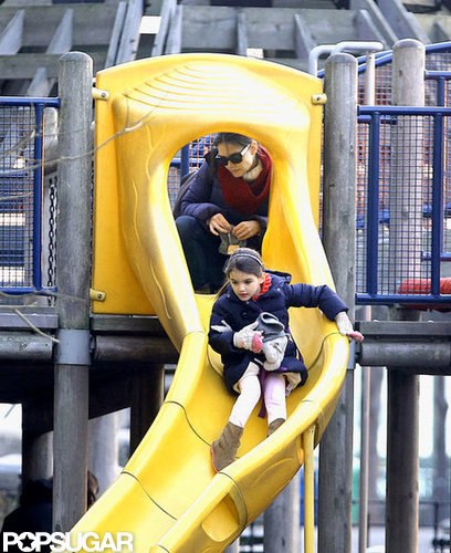 Katie Holmes watched Suri go down a slide.
Katie Holmes watched Suri go down a slide.