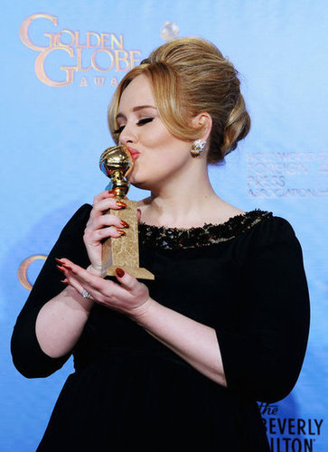 Adele kissed her Golden Globe for best original song.
Adele kissed her Golden Globe for best original song.