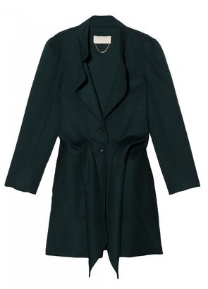 Contrast Vanessa Bruno's tie-front coat ($928, originally $1,325) with gray cropped trousers and oxfords for a casual work look.
Contrast Vanessa Bruno's tie-front coat ($928, originally $1,325) with gray cropped trousers and oxfords for a casual work look.