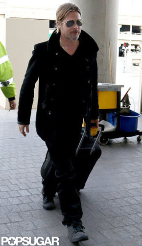 Brad Pitt wore an all black ensemble to travel out of LAX.
Brad Pitt wore an all black ensemble to travel out of LAX.