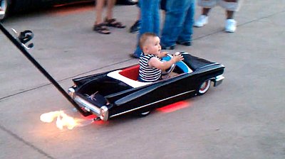 Incredible "Cadillac" Baby Stroller Shoots Flames (VIDEO)