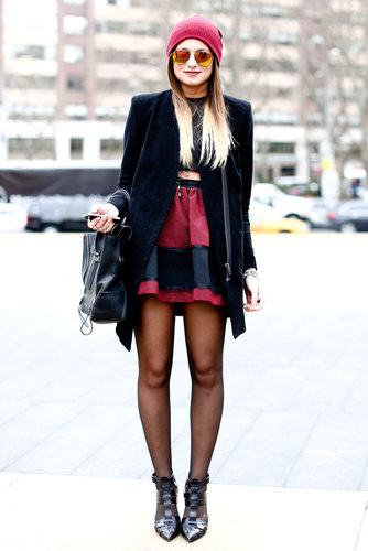 Mirrored shades gave her deep red-and-black palette a cooler tone.
Mirrored shades gave her deep red-and-black palette a cooler tone.