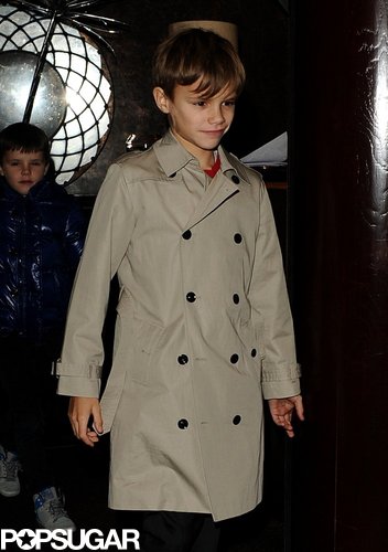Romeo Beckham looked precious in his trench coat.
Romeo Beckham looked precious in his trench coat.