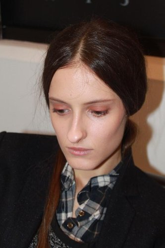 For makeup, Carole Colombani used a palette of autumnal colors, comprising of beige, terracotta, and red. Skin was left clean, and the lashes were devoid of mascara. Even the lips were just brushed over with the excess product from the foundation brush . . . no color. The cheeks had a slight dewy contour created by mixing two neutral lipsticks. "Makeup is freedom," she said. "It's really important for women to test and not be afraid of putting eye shadows on your mouth."
For makeup, Carole Colombani used a palette of autumnal colors, comprising of beige, terracotta, and red. Skin was left clean, and the lashes were devoid of mascara. Even the lips were just brushed over with the excess product from the foundation brush . . . no color. The cheeks had a slight dewy contour created by mixing two neutral lipsticks. "Makeup is freedom," she said. "It's really important for women to test and not be afraid of putting eye shadows on your mouth."