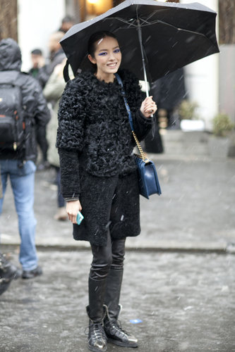 Battling the snow with umbrella in hand, and the most luxurious of outerwear.
Battling the snow with umbrella in hand, and the most luxurious of outerwear.