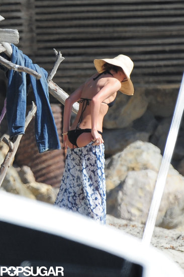 Miranda Kerr slipped into a black bikini for a beach day with her family in LA.
Miranda Kerr slipped into a black bikini for a beach day with her family in LA.