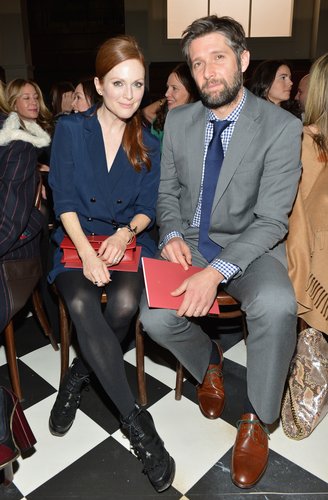 Julianne Moore chose a navy blue double-breasted coat dress, along with cool-girl booties and a red clutch, to take in the Tommy Hilfiger Fall '13 show.
Julianne Moore chose a navy blue double-breasted coat dress, along with cool-girl booties and a red clutch, to take in the Tommy Hilfiger Fall '13 show.