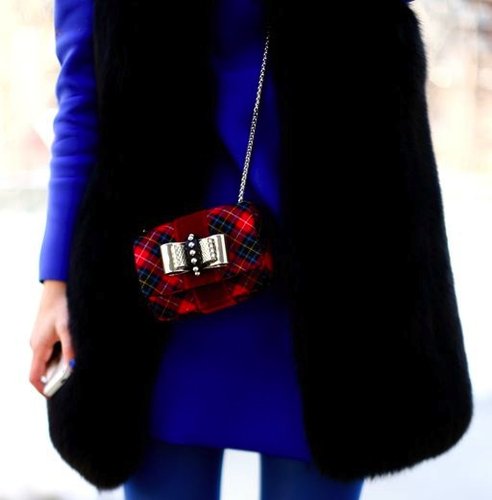 The silver bow takes takes this mini plaid bag to the next level of cuteness.
The silver bow takes takes this mini plaid bag to the next level of cuteness.