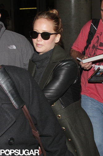 Jennifer Lawrence Gets the Giggles While Flying Home With Her Teddy Jennifer Lawrence Gets the Giggles While Flying Home With Her Teddy