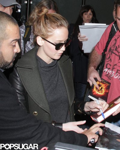 Jennifer Lawrence Gets the Giggles While Flying Home With Her Teddy Jennifer Lawrence Gets the Giggles While Flying Home With Her Teddy