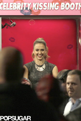 Jessica Alba stayed in a booth while fans kissed her through a layer of plexiglass.
Jessica Alba stayed in a booth while fans kissed her through a layer of plexiglass.