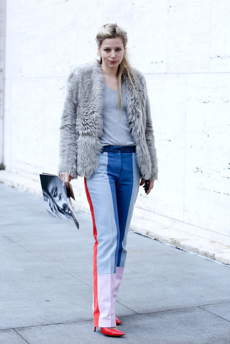 Colorblocked pants and bright heels get tempered with an understated fur and t-shirt.
Colorblocked pants and bright heels get tempered with an understated fur and t-shirt.