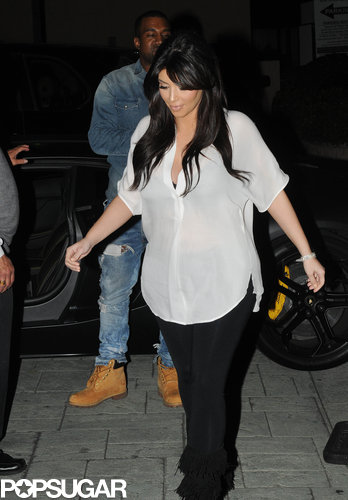 Kim Kardashian covered her baby bump with a sheer white blouse for a Valentine's date with boyfriend Kanye West.
Kim Kardashian covered her baby bump with a sheer white blouse for a Valentine's date with boyfriend Kanye West.