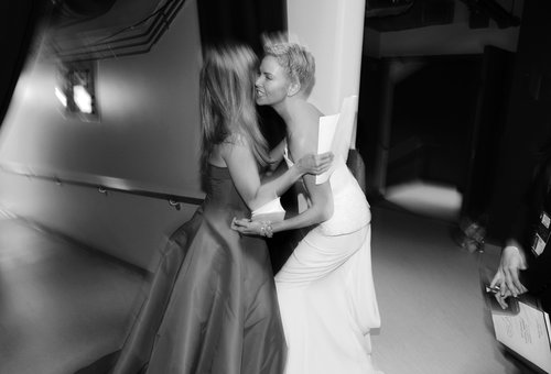 Jennifer Aniston and Charlize Theron stopped to embrace backstage.
Jennifer Aniston and Charlize Theron stopped to embrace backstage.