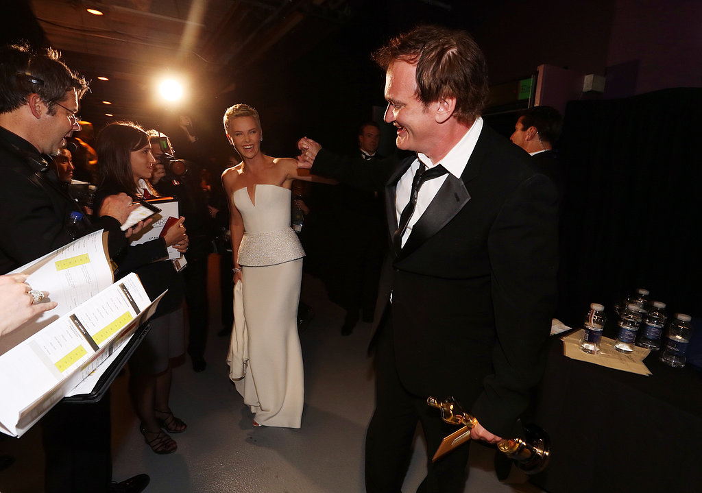 Charlize Theron motioned to Quentin Tarantino.
Charlize Theron motioned to Quentin Tarantino.