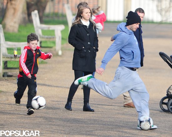 David Beckham kicked a soccer ball with his kids.
David Beckham kicked a soccer ball with his kids.