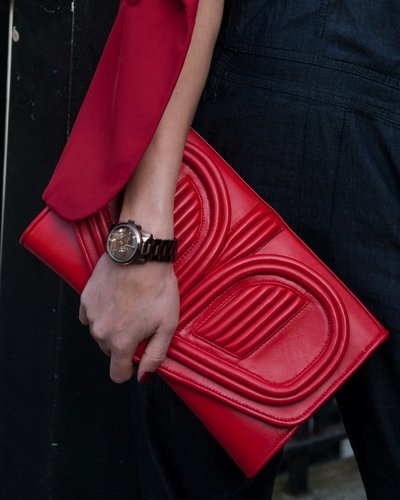 A red clutch popped against black separates.
A red clutch popped against black separates.