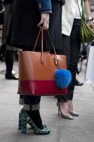 A colorblocked tote tempered a pair of wild animal-print pumps.
A colorblocked tote tempered a pair of wild animal-print pumps.