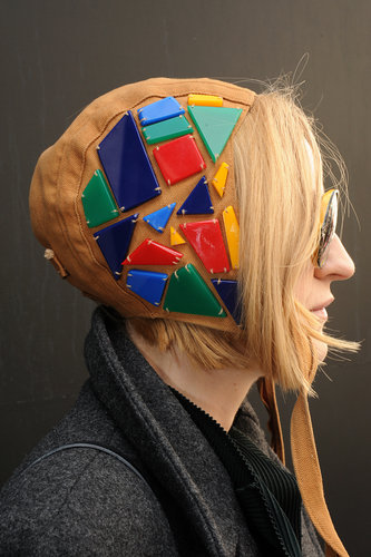 This LFW attendee sported an aviator hat adorned with multicolored stones.
This LFW attendee sported an aviator hat adorned with multicolored stones.