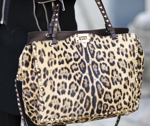 Valentino's studded leopard-print bag popped against a sleek black coat.
Valentino's studded leopard-print bag popped against a sleek black coat.