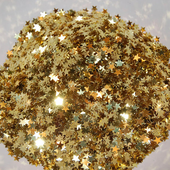 A sprinkling of this gold star confetti ($2) against a white tablecloth can mimic the effect of a shimmering table runner (for a fraction of the price!).
A sprinkling of this gold star confetti ($2) against a white tablecloth can mimic the effect of a shimmering table runner (for a fraction of the price!).