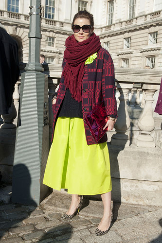 This showgoer tempered her citron-hued Tibi skirt with a navy knit and burgundy layers.
This showgoer tempered her citron-hued Tibi skirt with a navy knit and burgundy layers.