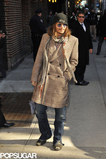 Johnny Depp wore his signature blue glasses for a stop at the Late Show in NYC. Johnny Depp wore his signature blue glasses for a stop at the Late Show in NYC.