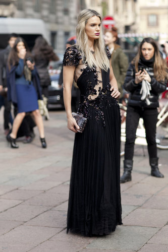 There are some that dress for function at Fashion Week; this glamorously attired showgoer is clearly not that type. She hit the shows in a red-carpet-ready gown.
There are some that dress for function at Fashion Week; this glamorously attired showgoer is clearly not that type. She hit the shows in a red-carpet-ready gown.