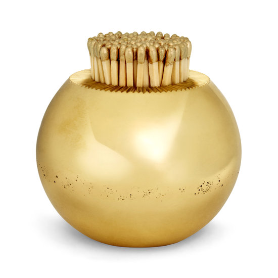 You can get the glamorous look of her home with simple gold pieces like this sleek round match striker ($190), which would look great on a basic wooden coffee table.
You can get the glamorous look of her home with simple gold pieces like this sleek round match striker ($190), which would look great on a basic wooden coffee table.