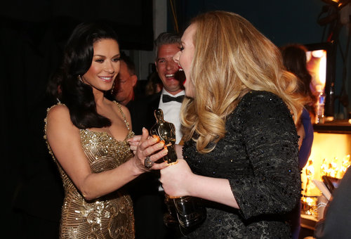 Adele celebrated her win with Catherine Zeta-Jones at the Oscars.
Adele celebrated her win with Catherine Zeta-Jones at the Oscars.