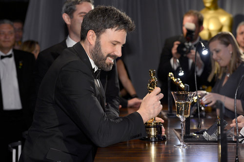 Ben Affleck smiled at his Oscar at the Governors Ball.
Ben Affleck smiled at his Oscar at the Governors Ball.