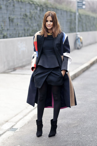 Christine Centenera played expertly with proportion in a peplum top, structured mini, and an oversize coat.
Christine Centenera played expertly with proportion in a peplum top, structured mini, and an oversize coat.