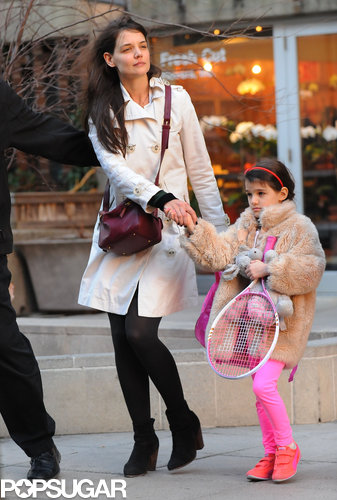 Suri Picks Up a Pink Racket For Tennis With Katie Holmes Suri Picks Up a Pink Racket For Tennis With Katie Holmes