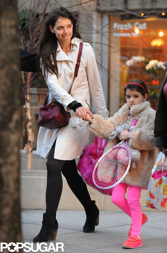 Suri Picks Up a Pink Racket For Tennis With Katie Holmes Suri Picks Up a Pink Racket For Tennis With Katie Holmes