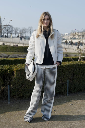 This showgoer kept her sleek black and white palette consistent, from her striped wide-leg trousers to her top, jacket, and clutch.
This showgoer kept her sleek black and white palette consistent, from her striped wide-leg trousers to her top, jacket, and clutch.