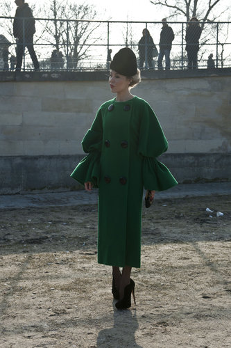 Sculpted bell sleeves and a brilliant emerald green added to the drama of Ulyana Sergeenko's look.
Sculpted bell sleeves and a brilliant emerald green added to the drama of Ulyana Sergeenko's look.