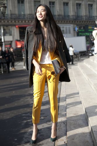 We love the cool color play at work here between the bright yellow, suiting, gray coat, and rich green heels.
We love the cool color play at work here between the bright yellow, suiting, gray coat, and rich green heels.