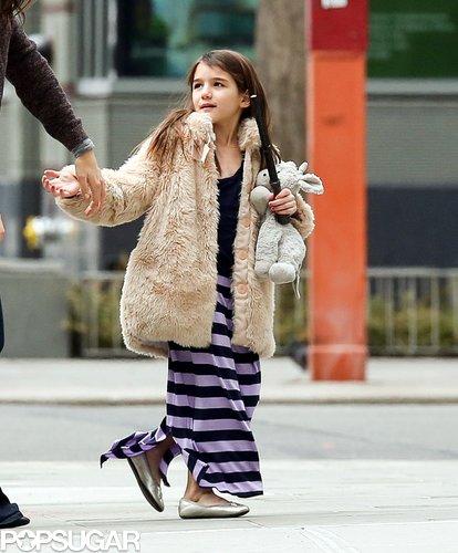 Suri Cruise held onto a stuffed animal.
Suri Cruise held onto a stuffed animal.
