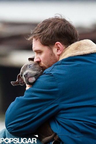 Tom Hardy Cuddles Up to a Canine Costar on Set Tom Hardy Cuddles Up to a Canine Costar on Set