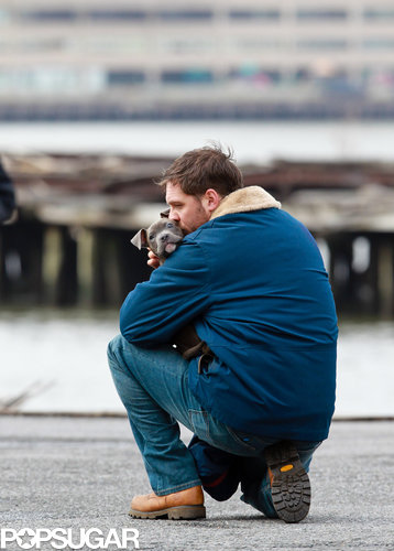 Tom Hardy and his four-legged costar shared a moment on the set of his film Animal Rescue in March.
Tom Hardy and his four-legged costar shared a moment on the set of his film Animal Rescue in March.