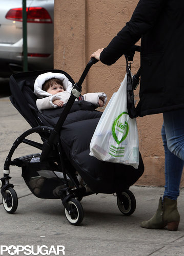 Marlowe bundled up in a white coat.
Marlowe bundled up in a white coat.