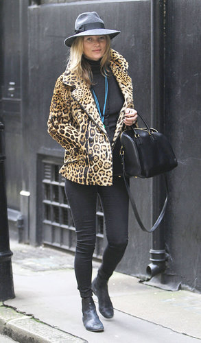 Behold a quintessential Kate Moss look: a leopard coat with black skinny jeans, a Saint Laurent duffel and black booties.
Behold a quintessential Kate Moss look: a leopard coat with black skinny jeans, a Saint Laurent duffel and black booties.