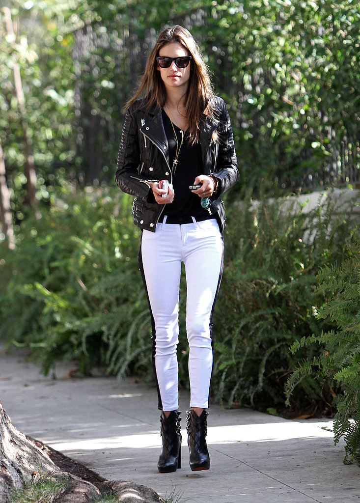 Alessandra Ambrosio kept her color palette black and white in Hudson tuxedo jeans, a black leather biker jacket, Christian Louboutin buckle booties, and Westward Leaning sunglasses during a stroll in LA.
Alessandra Ambrosio kept her color palette black and white in Hudson tuxedo jeans, a black leather biker jacket, Christian Louboutin buckle booties, and Westward Leaning sunglasses during a stroll in LA.