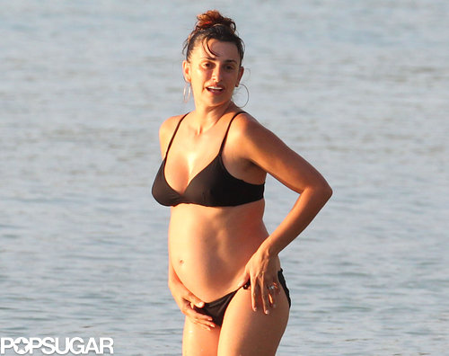 Penélope Cruz showed off her baby bump in a black bikini.
Penélope Cruz showed off her baby bump in a black bikini.