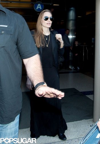 Angelina Denies Wedding Ring Rumors Upon Returning to LA Angelina Denies Wedding Ring Rumors Upon Returning to LA