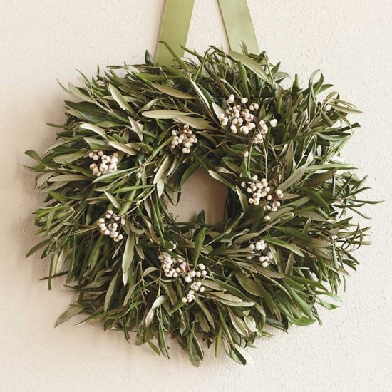 As seen displayed on the cupboard, this olive wreath ($69) would also make a great centerpiece laid flat on a table.
As seen displayed on the cupboard, this olive wreath ($69) would also make a great centerpiece laid flat on a table.