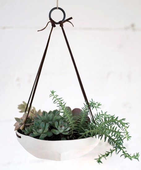 This shallow, unglazed planter ($76) looks great with plants, but we can also imagine using it in the kitchen as a hanging fruit bowl.
This shallow, unglazed planter ($76) looks great with plants, but we can also imagine using it in the kitchen as a hanging fruit bowl.