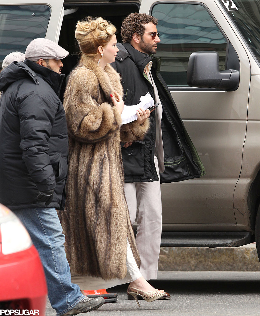Jennifer Lawrence wore an updo on a Boston set with a curly-haired Bradley Cooper. Jennifer Lawrence wore an updo on a Boston set with a curly-haired Bradley Cooper.