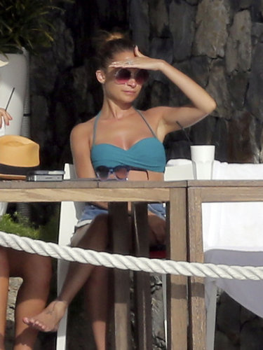Nicole Richie lounged beachside in a teal halter bikini, denim cutoffs, and oversized round sunglasses in St. Barts in April.
Nicole Richie lounged beachside in a teal halter bikini, denim cutoffs, and oversized round sunglasses in St. Barts in April.