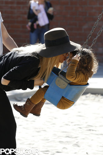 Rachel Zoe kissed Skyler on a swing.
Rachel Zoe kissed Skyler on a swing.